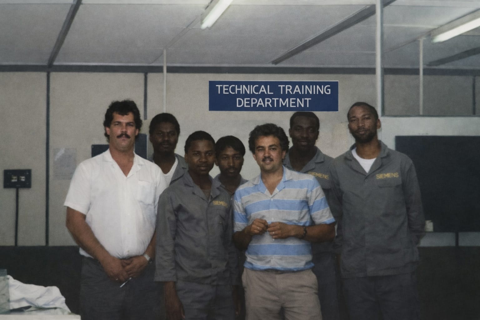 Peter pic About Us 2- peter with stripe tshirt. He is training his apprentices Peter Seymour and his apprentices.